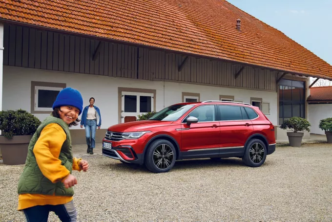 Kids running around Tiguan
